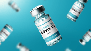 COVID-19 Vaccine Rollout Blog Image Vaccine Vials Floating Blue Space